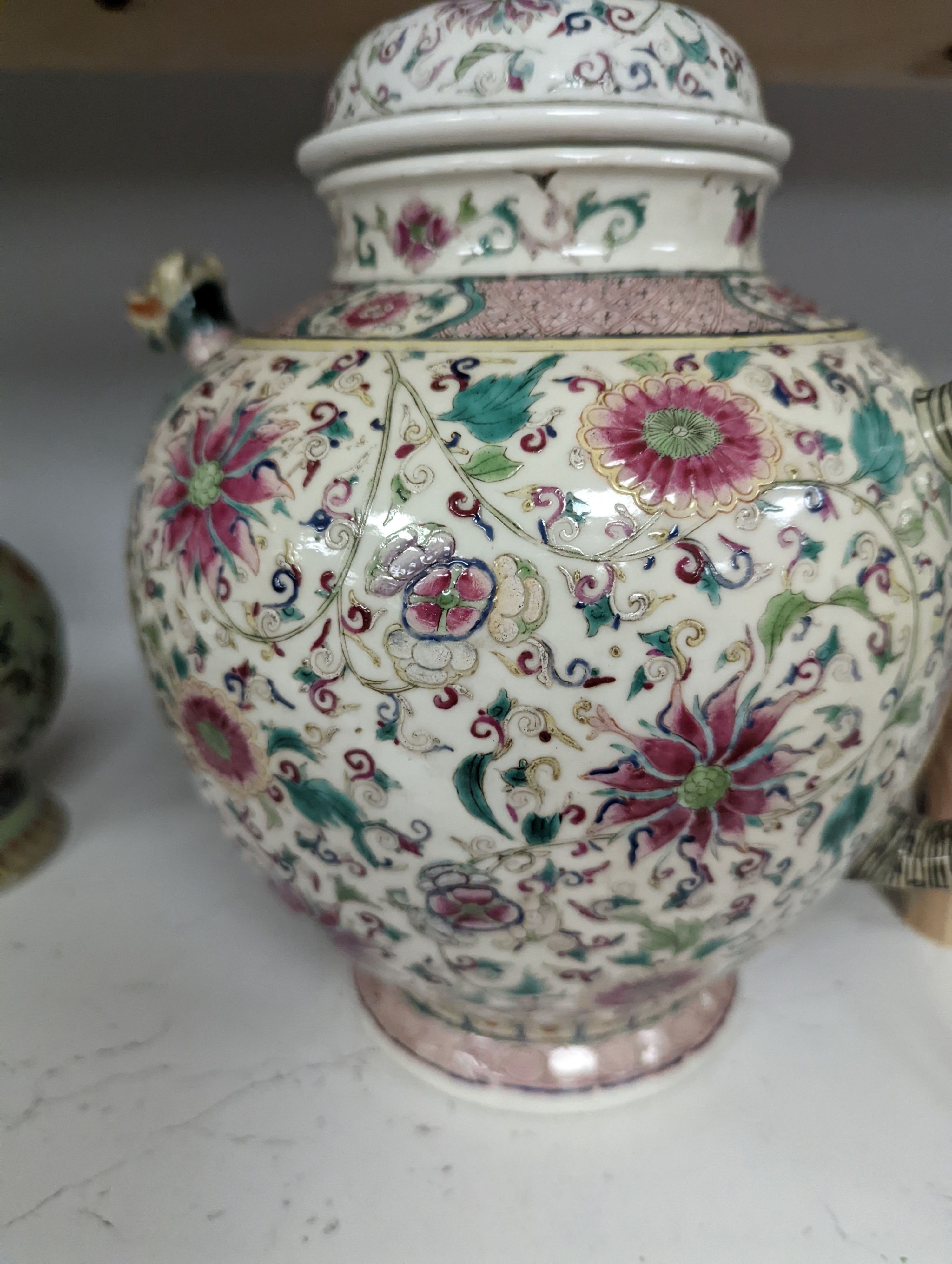A large 19th century Chinese famille rose wine pot, and another wine pot, tallest 27cm